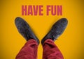 Have fun text and Grey shoes on feet with yellow background