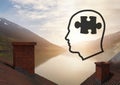 Head with puzzle piece icons over roofs by mountain lake Royalty Free Stock Photo