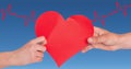 Heart beat over hands holding heart Royalty Free Stock Photo