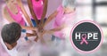 Hope text with breast cancer awareness women putting hands together Royalty Free Stock Photo