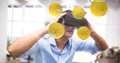 Digital composite image of businessman looking at emojis through VR glasses Royalty Free Stock Photo