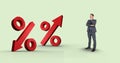 Digital composite image of businessman looking at percentage signs Royalty Free Stock Photo