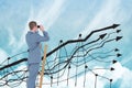 Digital composite image of businessman using binoculars on ladder with graph in sky Royalty Free Stock Photo