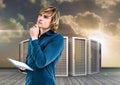 Digital composite image of businessman using digital tablet against server tower Royalty Free Stock Photo