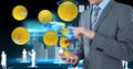 Digital composite image of businessman using smart phone with various emojis