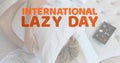 Digital composite image of caucasian woman hugging pillow with international lazy day text at home