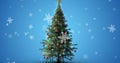 Digital composite image of christmas tree and snowflakes against blue background with copy space Royalty Free Stock Photo