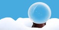 Digital composite image of empty decorative globe on snow against blue background Royalty Free Stock Photo