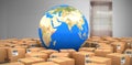 Composite image of digital composite image of globe amidst cardboard boxes Royalty Free Stock Photo