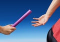 Digital composite image of hands passing the baton Royalty Free Stock Photo