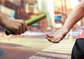 Digital composite image of hands passing the baton Royalty Free Stock Photo