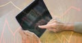 Digital composite image of hands using tablet PC with binary code and graphs Royalty Free Stock Photo