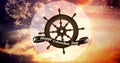 Digital composite image of happy columbus day with ship\'s wheel symbol over us flag and fireworks