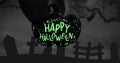 Digital composite image of happy halloween text in spooky cemetery at night, copy space