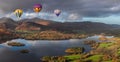 Digital composite image of hot air balloons over Beautiful landscape Autumn image of view from Walla Crag in Lake District, over Royalty Free Stock Photo