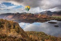 Digital composite image of hot air balloons over Beautiful landscape Autumn image of view from Walla Crag in Lake District, over Royalty Free Stock Photo