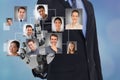 Digital composite image of HR`s robot hand selecting candidates Royalty Free Stock Photo