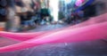 Digital composite image of pink digital wave and spots of light against view of city traffic Royalty Free Stock Photo