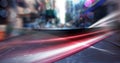 Digital composite image of red digital waves and spot of light against view of city traffic Royalty Free Stock Photo