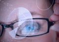 Digital composite image of round scanner and data processing against close up of female human eye Royalty Free Stock Photo