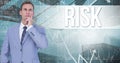 Digital composite image of thoughtful businessman standing against risk text and graphs