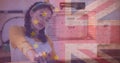 Digital composite image of young woman at petrol station with european union and british flag