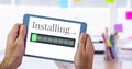 Installing progress status power bar and tablet device Royalty Free Stock Photo