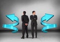 Left or right arrows with Businessman looking in opposite directions Royalty Free Stock Photo