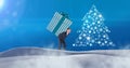 Man carrying gift box and Snowflake Christmas tree pattern shape in snow landscape Royalty Free Stock Photo