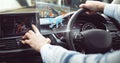 Man driving in car with heads up display interface