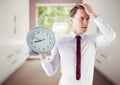 man holding clock in front of room window Royalty Free Stock Photo