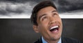 Man looking up and laughing with grey background Royalty Free Stock Photo