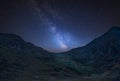 Digital composite Milky Way image of Beautiful dramatic landscape image of Nant Francon valley in Snowdonia
