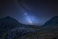 Digital composite Milky Way image of Beautiful dramatic landscape image of Nant Francon valley in Snowdonia