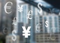 Mixed Currency icons over city Royalty Free Stock Photo