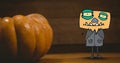 Monster cartoon standing next to halloween pumpkin Royalty Free Stock Photo