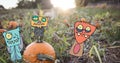 Monster cartoons standing on halloween pumpkin field Royalty Free Stock Photo