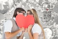 Digital composite of romantic nerd couple kissing behing a red heart