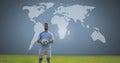 Soccer player holding football with world map Royalty Free Stock Photo