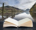 Digital composite of Stunning Autumn Fall landscape image of Lake Buttermere in Lake District England in pages of open book Royalty Free Stock Photo