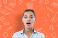 Surprised or confused woman on orange background surrounded by drawings