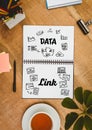 Table top with a notebook with web graphics Royalty Free Stock Photo