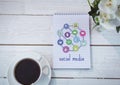 Table top with a notebook with web graphics Royalty Free Stock Photo