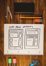 Table top with a notebook with web graphics Royalty Free Stock Photo
