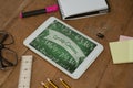 Tablet on a school table with school icons on screen Royalty Free Stock Photo