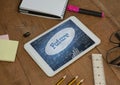 Tablet on a school table with school icons on screen Royalty Free Stock Photo