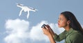 Woman flying a drone silhouette in sky Royalty Free Stock Photo