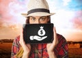Woman holding tablet with hand giving money bag icon Royalty Free Stock Photo