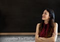 Woman standing in front of blackboard Royalty Free Stock Photo