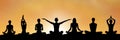 yoga group silhouette at sunset Royalty Free Stock Photo